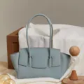 Light blue leather shoulder bag detail, stylish women tote bag with long handles and elegant design. - Flax Blue