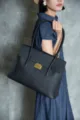 Premium genuine leather tote bag for women, large capacity commute shoulder bag with classic metal lock. - Black