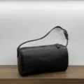 Dark brown leather barrel bag, minimalist 90s style shoulder bag for daily casual chic wear. - Ebony