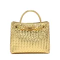 Gold woven leather handbag detail featuring stylish metal handle and knot hardware for women. - Gold