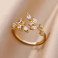 Macro view showing the detailed zircon leaf design on a gold plated adjustable open ring - Adjustable Open / Pave Full Rhinestone Leaf (ESF393#) / Gold