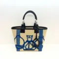 Stylish canvas leather tote bag featuring blue equestrian stirrup print, large capacity handbag. - Totem Blue and Black