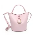 Elegant pink leather bucket bag with top handle and unique gold ring braid detail main view. - Pink
