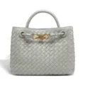 Elegant grey woven leather handbag featuring metal knot handle and spacious tote design. - Agate Gray