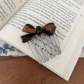 Detailed view of sweet bow hair comb, elegant acetate and metal hair accessory for women. - Black Coffee - Thickened Acetate Hair Comb