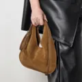 Brown suede hobo bag detail shot, showing soft leather texture and stylish metal buckle design. - 27*2*30cm / Brown