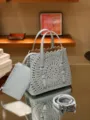 Light blue leather laser-cut tote bag with handle, matching pouch, and detachable shoulder strap. - 20*18*10cm / Denim Blue