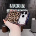 Detailed view of luxury leopard print rhinestone phone case with dazzling crystals and purple frame. - Electroplated Rhinestone Leopard Print - Purple Edge / iPhone13