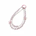 Detailed view of multi-strand beaded phone charm with pink pearls, crystals, and cute bows. - Pink Double Chain