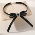 Detailed view of black PU leather choker necklace featuring a bow and rhinestone star. - Star Style (NZ3627xingxing)