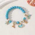 Sommerlicher Ozean Stil Perlenarmband mit Muschel und Seestern Anhängern Damen Schmuck - Armband / Blaue Armband