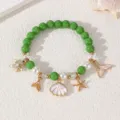 Sommer Ozean Stil Perlenarmband mit grünen Perlen, Muschel und Seestern Anhänger Strand. - Grünes Armband