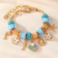 Vergoldetes Meeres-Charm-Armband mit blauen Karopunkten und niedlichen Meerestier-Anhängern. - Blau Weiß Gitter Meerestier Stil (BZ2409lanseHB)