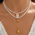 Mehrlagige Halskette mit weißen Perlen, Muschel, Seestern und Schildkröten Anhänger für Damen. - Dreireihiges Halsketten-Set (NS0028-1)