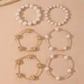 Set di bracciali impilabili con perle e sfere dorate alla moda, gioielli eleganti da donna. - modello 3