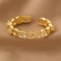 Vergoldeter Glieder-Ring mit funkelnden Zirkoniasteinen, offenes verstellbares Modeschmuck-Design. - Feine Kette Stil (RZ0908xiliantiao)