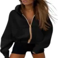 Stylish women's black cropped zip-up hoodie sweatshirt featuring a gold zipper. - S / Tops / Black