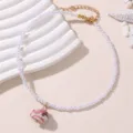 Elegante Perlenketten Halskette mit süßem Keramik Fisch Anhänger, stilvoller Modeschmuck. - Rosa und Weiß (NZ3247)