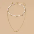 Zweilagige Halskette mit Perlen-Choker, Schmetterlingsanhänger und stilvollem Sternzeichen-Anhänger Libra. - Waage Sternzeichen (NZ2887) / Gold
