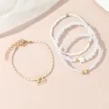 Mehrlagiges Perlenarmband Set mit Sternzeichen Waage Anhänger und schicken Perlen für Damen. - Waage / 4-teiliges Set