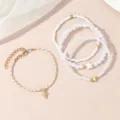 Detailansicht des mehrschichtigen Perlenarmband-Sets mit Sternzeichen-Anhänger und Perlen. - Schütze / 4-teiliges Set