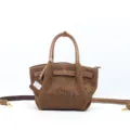 Borsa a mano dumpling vintage in vera pelle bovina goffrata con tracolla di colore cachi. - Kaki