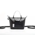 Borsa a tracolla nera in pelle da donna, elegante borsa a mano con manico e tracolla. - Nero