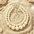 Collana girocollo bohémien a doppio strato in perle di resina vista principale mare. - Bianco avorio