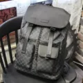 Men's stylish business casual backpack with classic monogram canvas and leather flap design. - New Plaid