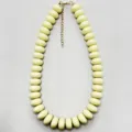 Chic women's plastic flat bead necklace with gold tone extension chain for daily wear. - White