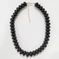 Black chunky flat bead statement necklace for women, stylish bohemian jewelry accessory. - Black