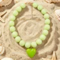 Light green acrylic round bead necklace with a cute heart pendant for women summer beach. - Verdant