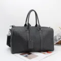 Men's black woven leather travel duffel bag, large capacity business luggage handbag. - Black