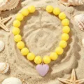 Collier de perles en acrylique jaune avec pendentif cœur rose, bijoux de plage d'été mignons. - Jaune