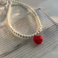 Collier de perles tendance avec pendentif cœur rouge, bijoux élégant pour femmes au quotidien. - Couleur Perle