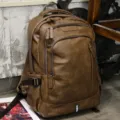 Vintage brown PU leather backpack for men, multi-compartment travel business laptop bag. - Brown