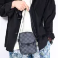 Men's casual vertical crossbody phone bag, trendy checkered design with adjustable shoulder strap. - Checkered
