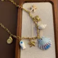 Ocean style DIY titanium steel charm necklace detail featuring seashell and starfish pendants. - Shell Necklace (03-E27) / Gold