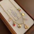 Titanium steel charm necklace with cute multi-pendant design for women daily fashion jewelry. - Flower Necklace (05-E25) / Gold