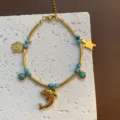 Ocean style titanium steel necklace with dolphin and turtle pendants, elegant gift. - Dolphin Bracelet (07-E26) / Gold