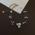 Multi-layer pearl choker necklace on invisible fishing line with gold extension chain. - Style 2