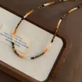 Retro Maillard Tigerauge Perlen Halskette mit funkelnden Kristallen und goldenen Elementen. - Kristall Gemischte Tigerauge Vintage Halskette (18)