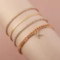 Detailed close-up view of a 4-piece gold tone rhinestone letter K anklet and bracelet set. - Four Piece Set Letter K Style (FZ0192) / Gold
