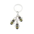 Metal enamel bee keychain detailed shot showing three cute bee pendants and standard keyring. - Enamel Bee Triple Pendant (ZMK0044baik)