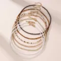 Bohemian seed bead necklace set for women, 7 pieces stacked choker chains, fashion multi-color jewelry. - Brown Tones