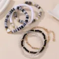 Mehrlagiges Perlenarmband-Set mit Polymer-Ton-Scheiben, Perlen und Anhänger für Damen. - Schwarz Weiß