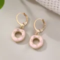 Chic gold-tone hoop earrings featuring cute pink donut enamel pendants for women and girls daily wear. - Donut Style