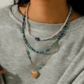 Mehrlagige Perlen-Halskette mit Herz-Anhänger, modisches Vintage-Schmuckset für Damen. - Evil Eye Bunte Perlen Stil (NZ2870) / Blaugrün