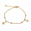 Pulsera chapada en oro de acero inoxidable con piedras de cristal y dijes de flores moda mujer. - Dorado
