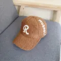 Close-up of brown sherpa baseball cap with white embroidered letter R and side text detail. - L (58-60cm) / Khaki